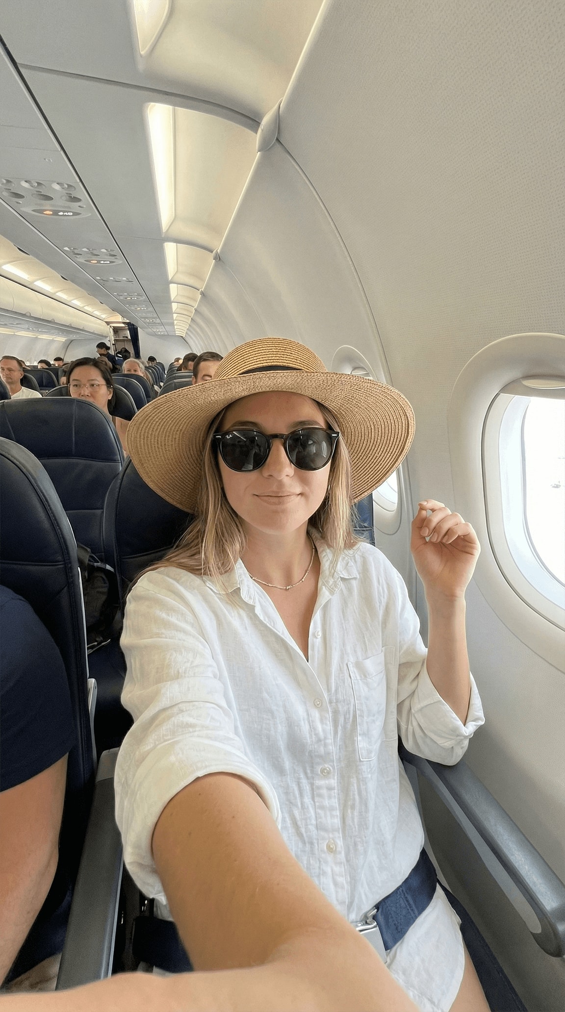 In-Flight Vacation Selfie — Natural Front Camera Perspective